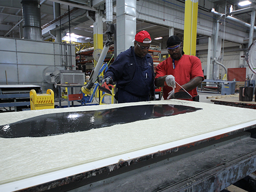 Employees working on a project at The Gund Company